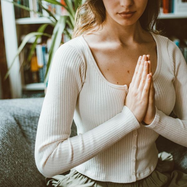 Cozy corner in a room set up for home yoga practice.